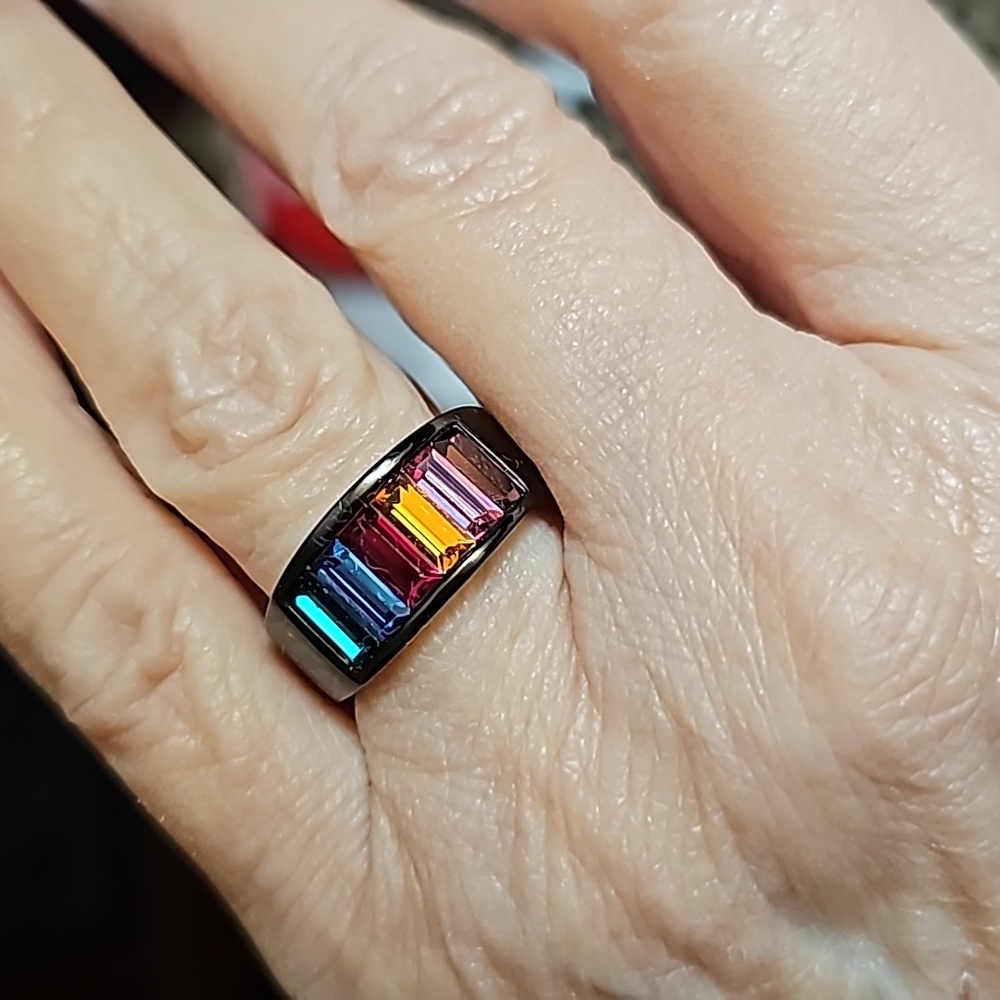 Costume ring with black band and multicolor stones